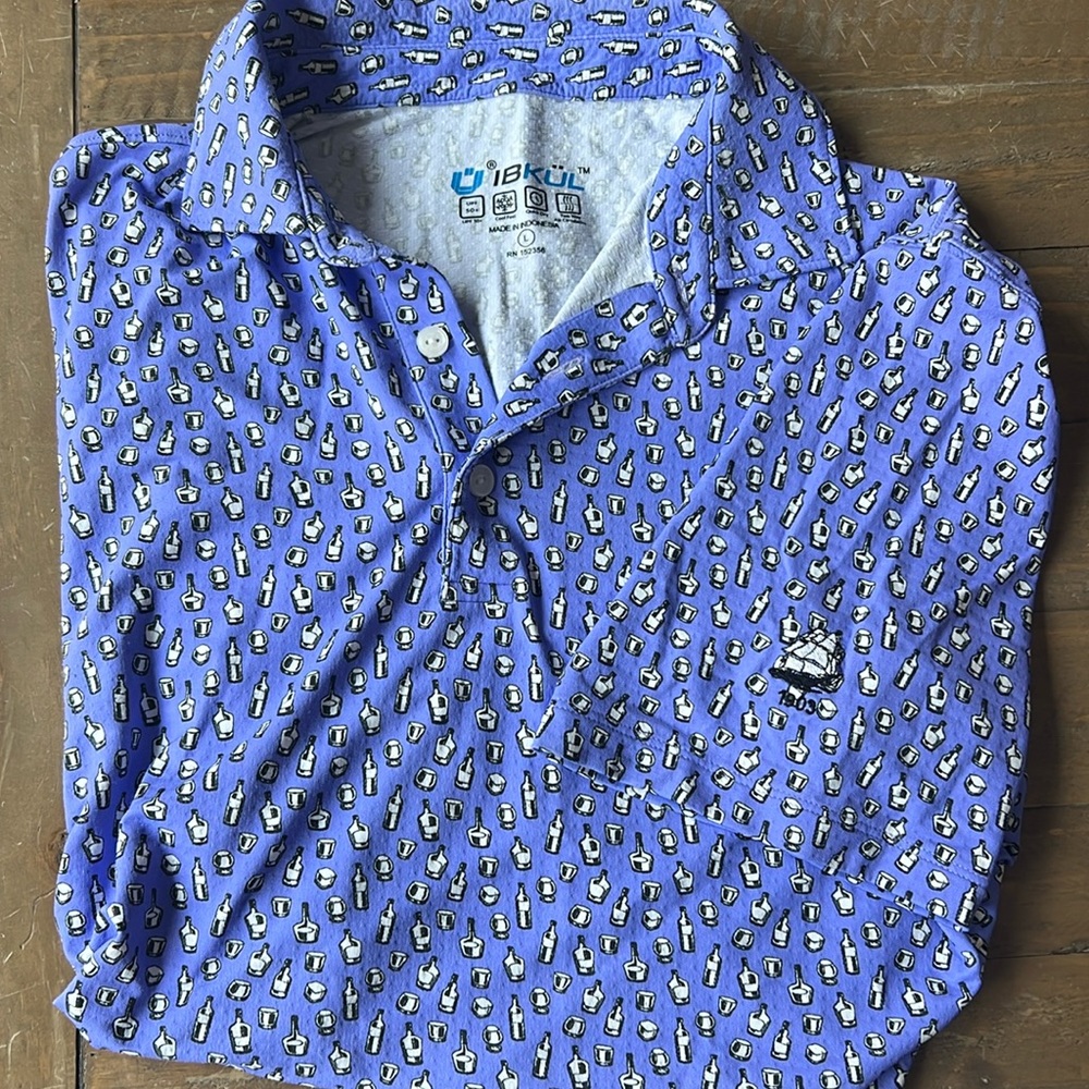 Men’s golf polo. Purple with whiskey glass and bottle print.